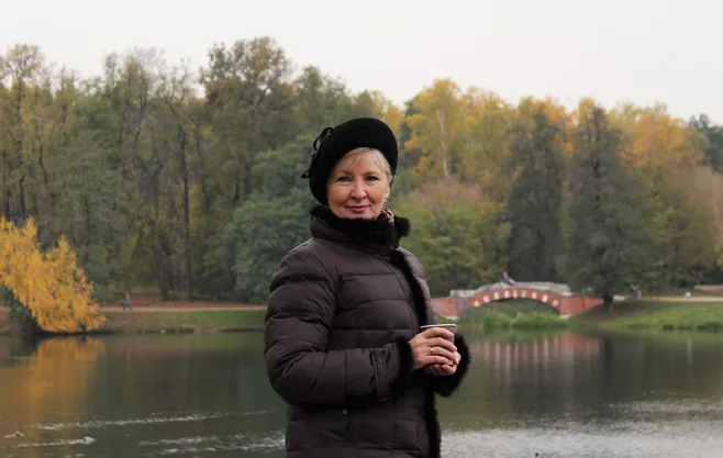 lady by lake bundled up lady by lake bundled up